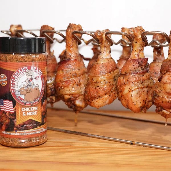 Cattleman's Brand Chicken & More seasoning with bacon-wrapped chicken drumsticks on a hanging rack