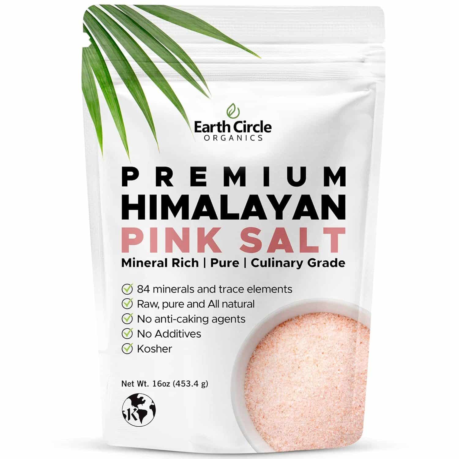 A white resealable pouch of Earth Circle Organics Premium Himalayan Pink Salt. The label highlights key features including "84 minerals and trace elements," "Raw, pure and all natural," "No anti-caking agents," "No additives," and "Kosher." The net weight is 16 oz (453.4 g), with a minimalistic design and a green leaf accent at the top left corner.
