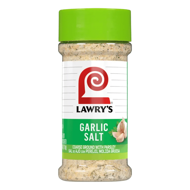 A bottle of Lawry's Garlic Salt with a green cap, featuring coarse ground garlic mixed with parsley, labeled in both English and Spanish.