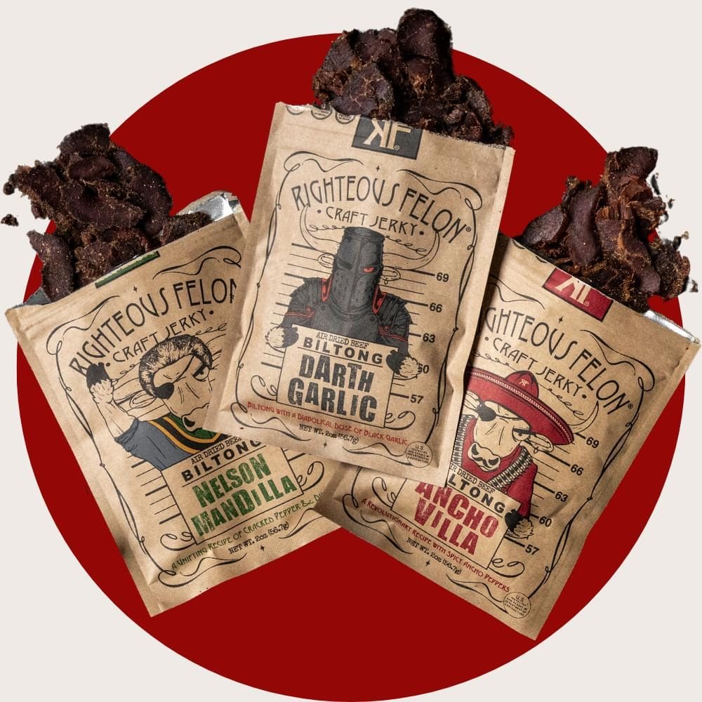 Three Righteous Felon Craft Jerky biltong flavors—Nelson Mandilla, Darth Garlic, and Ancho Villa—partially opened to reveal dried beef pieces, displayed against a red circular background.