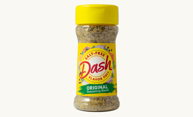 A bottle of Dash Original Salt-Free Seasoning Blend, a flavorful spice mix without salt, ideal for enhancing the taste of various dishes.