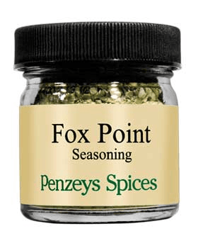 A jar of Penzeys Spices Fox Point Seasoning, a savory blend of herbs and spices designed to enhance the flavor of vegetables, seafood, and poultry dishes.